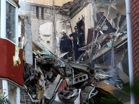 Rescuers are carrying out a search and rescue effort at an apartment block damaged by the June 28 Russian missile attack in Dnipro, Ukraine,...