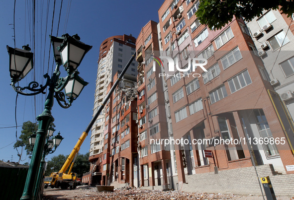 A crane is being used during a search and rescue effort at an apartment block damaged by the June 28 Russian missile attack in Dnipro, Ukrai...