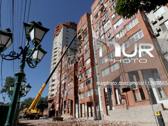 A crane is being used during a search and rescue effort at an apartment block damaged by the June 28 Russian missile attack in Dnipro, Ukrai...