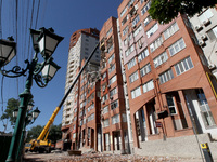 A crane is being used during a search and rescue effort at an apartment block damaged by the June 28 Russian missile attack in Dnipro, Ukrai...