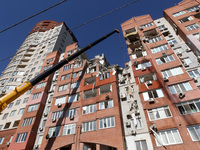 A crane is being used during a search and rescue effort at an apartment block damaged by the June 28 Russian missile attack in Dnipro, Ukrai...