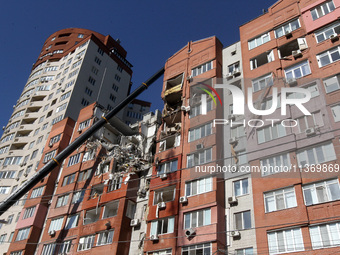 A crane is being used during a search and rescue effort at an apartment block damaged by the June 28 Russian missile attack in Dnipro, Ukrai...