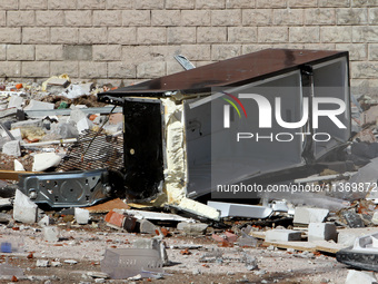 A broken fridge is lying on the ground outside the apartment block damaged by the June 28 Russian missile attack in Dnipro, Ukraine, on June...