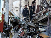 Rescuers are carrying out a search and rescue effort at an apartment block damaged by the June 28 Russian missile attack in Dnipro, Ukraine,...