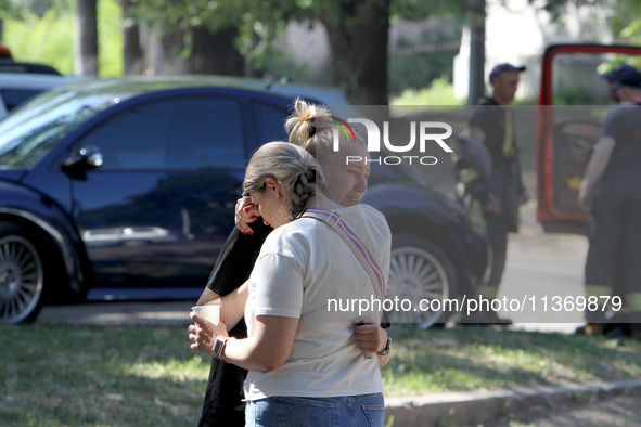 Women affected by the June 28 Russian missile attack on the apartment block are sharing an embrace in Dnipro, Ukraine, on June 29, 2024. Rus...