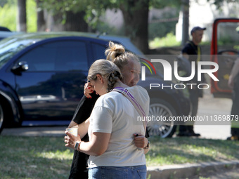 Women affected by the June 28 Russian missile attack on the apartment block are sharing an embrace in Dnipro, Ukraine, on June 29, 2024. Rus...