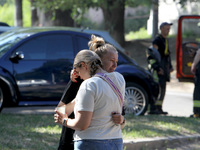 Women affected by the June 28 Russian missile attack on the apartment block are sharing an embrace in Dnipro, Ukraine, on June 29, 2024. Rus...