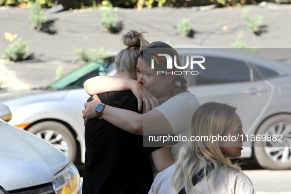 Women affected by the June 28 Russian missile attack on the apartment block are sharing an embrace in Dnipro, Ukraine, on June 29, 2024. Rus...