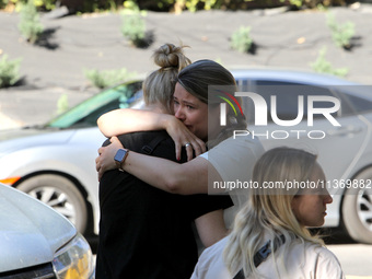 Women affected by the June 28 Russian missile attack on the apartment block are sharing an embrace in Dnipro, Ukraine, on June 29, 2024. Rus...