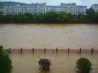 Part of the walking path is flooding as the water level of Yaqian River is rising due to heavy rainfall in Anqing, China, on June 29, 2024....