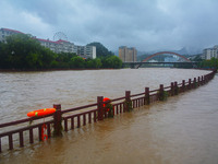 Part of the walking path is flooding as the water level of Yaqian River is rising due to heavy rainfall in Anqing, China, on June 29, 2024....