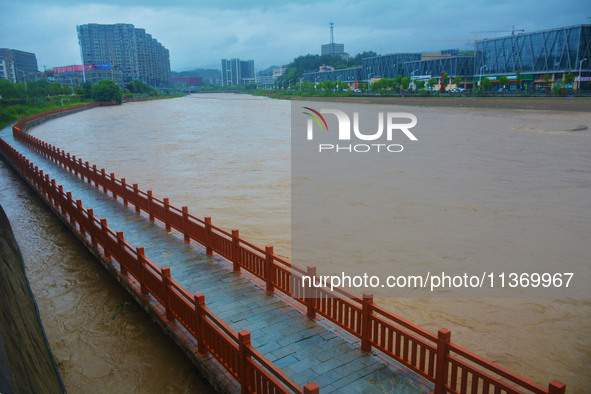 The water level of Yaqian River is rising after heavy rainfall in Anqing, China, on June 29, 2024. 