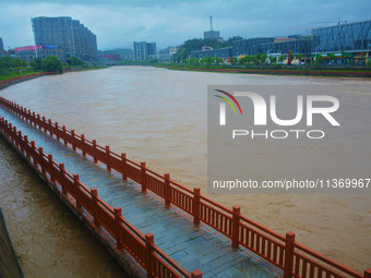 The water level of Yaqian River is rising after heavy rainfall in Anqing, China, on June 29, 2024. (