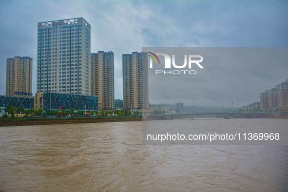 The water level of Yaqian River is rising after heavy rainfall in Anqing, China, on June 29, 2024. 