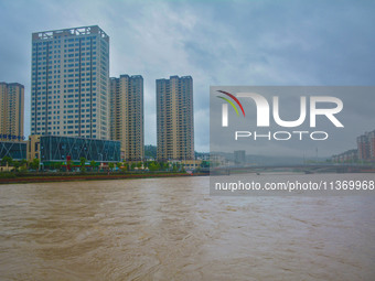 The water level of Yaqian River is rising after heavy rainfall in Anqing, China, on June 29, 2024. (