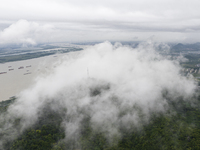 Ships are sailing on the Nanjing section of the Yangtze River in Nanjing, China, on June 29, 2024. (