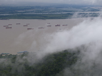 Ships are sailing on the Nanjing section of the Yangtze River in Nanjing, China, on June 29, 2024. (