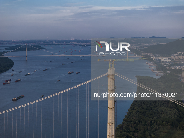 Ships are sailing on the Nanjing section of the Yangtze River in Nanjing, China, on June 29, 2024. 