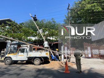 Workers are installing utility poles to support power lines in Kottarakkara, Kollam, Kerala, India, on April 06, 2024. (