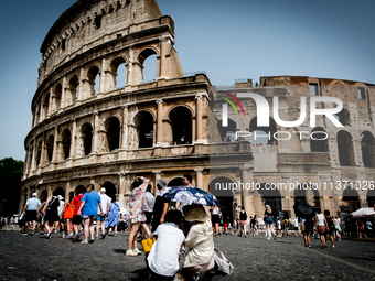 Tourists are visiting the Colosseum area, where temperatures are reaching 36 degrees Celsius in Rome, Italy, on June 29, 2024. (