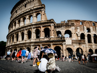 Tourists are visiting the Colosseum area, where temperatures are reaching 36 degrees Celsius in Rome, Italy, on June 29, 2024. (