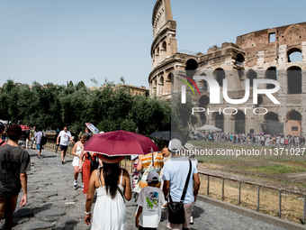 Tourists are visiting the Colosseum area, where temperatures are reaching 36 degrees Celsius in Rome, Italy, on June 29, 2024. (