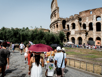 Tourists are visiting the Colosseum area, where temperatures are reaching 36 degrees Celsius in Rome, Italy, on June 29, 2024. (