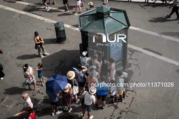 Tourists are queuing for heat at an Acea still or sparkling water dispenser in Rome, Italy, on June 29, 2024. 