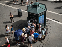 Tourists are queuing for heat at an Acea still or sparkling water dispenser in Rome, Italy, on June 29, 2024. (