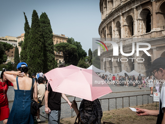 Tourists are visiting the Colosseum area, where temperatures are reaching 36 degrees Celsius in Rome, Italy, on June 29, 2024. (