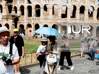 Tourists are visiting the Colosseum area, where temperatures are reaching 36 degrees Celsius in Rome, Italy, on June 29, 2024. (