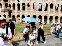 Tourists are visiting the Colosseum area, where temperatures are reaching 36 degrees Celsius in Rome, Italy, on June 29, 2024. (