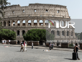 Tourists are visiting the Colosseum area, where temperatures are reaching 36 degrees Celsius in Rome, Italy, on June 29, 2024. (