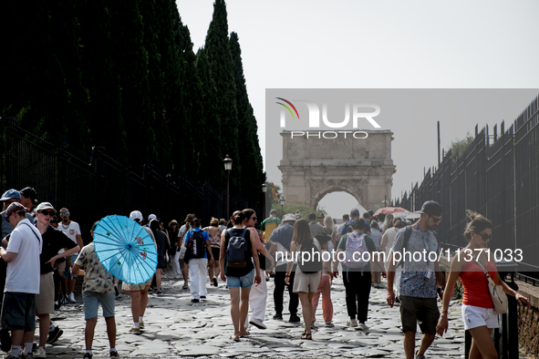 Tourists are visiting the Colosseum area, where temperatures are reaching 36 degrees Celsius in Rome, Italy, on June 29, 2024. 