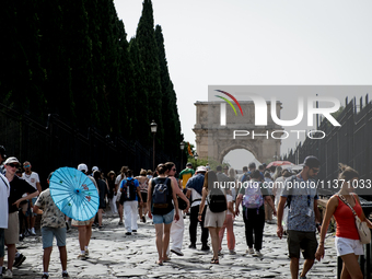 Tourists are visiting the Colosseum area, where temperatures are reaching 36 degrees Celsius in Rome, Italy, on June 29, 2024. (