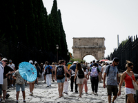 Tourists are visiting the Colosseum area, where temperatures are reaching 36 degrees Celsius in Rome, Italy, on June 29, 2024. (