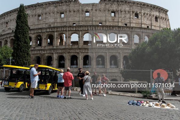 Tourists are visiting the Colosseum area, where temperatures are reaching 36 degrees Celsius in Rome, Italy, on June 29, 2024. 