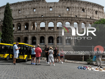 Tourists are visiting the Colosseum area, where temperatures are reaching 36 degrees Celsius in Rome, Italy, on June 29, 2024. (