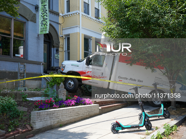 A U-haul truck is driving up the stairs and into a massage parlor in the Adams Morgan neighborhood of Washington D.C. No one is injured. 