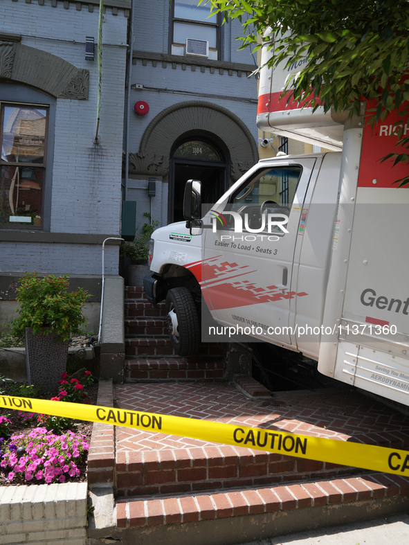 A U-haul truck is driving up the stairs and into a massage parlor in the Adams Morgan neighborhood of Washington D.C. No one is injured. 