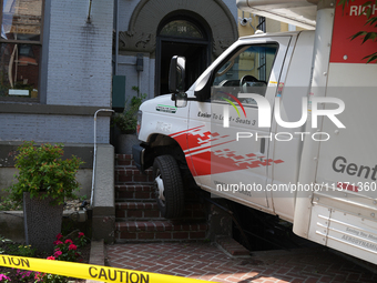 A U-haul truck is driving up the stairs and into a massage parlor in the Adams Morgan neighborhood of Washington D.C. No one is injured. (