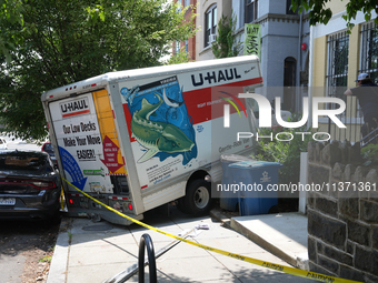 A U-haul truck is driving up the stairs and into a massage parlor in the Adams Morgan neighborhood of Washington D.C. No one is injured. (