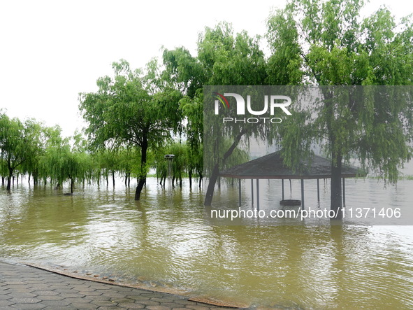 The Hankou Riverbank Park of the Yangtze River is flooding in Wuhan, China, on June 29, 2024. Heavy rain is continuing in Wuhan. 