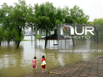 The Hankou Riverbank Park of the Yangtze River is flooding in Wuhan, China, on June 29, 2024. Heavy rain is continuing in Wuhan. (