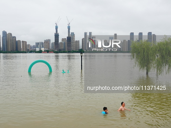 The Hankou Riverbank Park of the Yangtze River is flooding in Wuhan, China, on June 29, 2024. Heavy rain is continuing in Wuhan. 