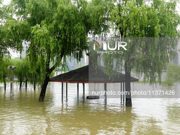 The Hankou Riverbank Park of the Yangtze River is flooding in Wuhan, China, on June 29, 2024. Heavy rain is continuing in Wuhan. 