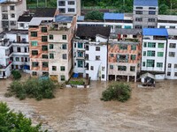 Aerial photo is showing houses and fields along the Wuyang River's Cenggong and Zhenyuan Yangping sections being flooded in Qiandongnan Pref...