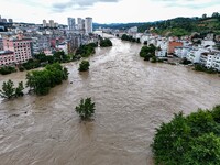 Aerial photo is showing houses and fields along the Wuyang River's Cenggong and Zhenyuan Yangping sections being flooded in Qiandongnan Pref...