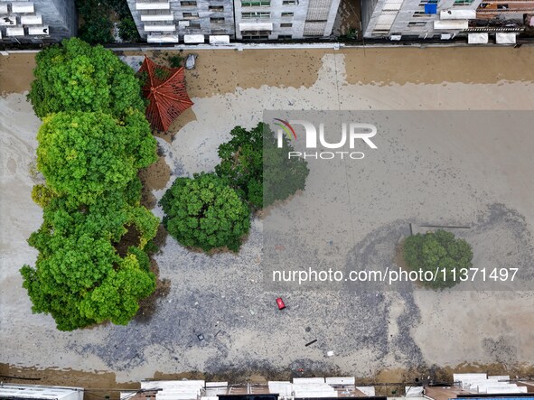 Aerial photo is showing houses and fields along the Wuyang River's Cenggong and Zhenyuan Yangping sections being flooded in Qiandongnan Pref...