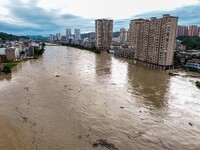 Aerial photo is showing houses and fields along the Wuyang River's Cenggong and Zhenyuan Yangping sections being flooded in Qiandongnan Pref...